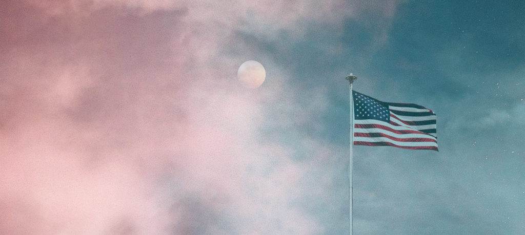 American flag with full moon